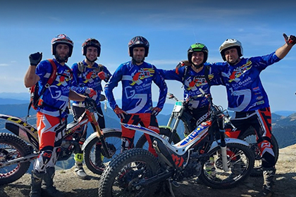 Competition motorbike team, with customized equipment by Protex, in white, fluorescent red and black, according to the customer's taste.